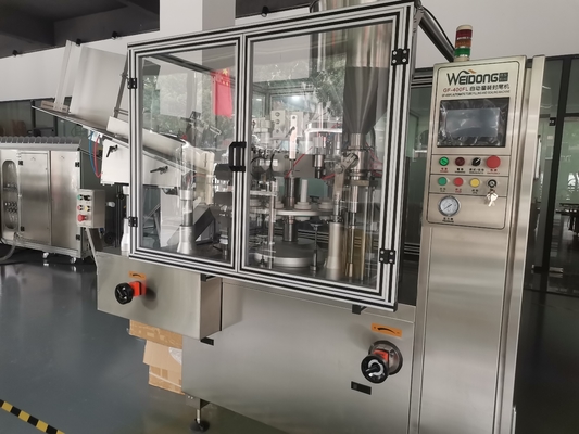 Automatische machine voor het vullen en afdichten van gelamineerde buizen voor industrieel gebruik